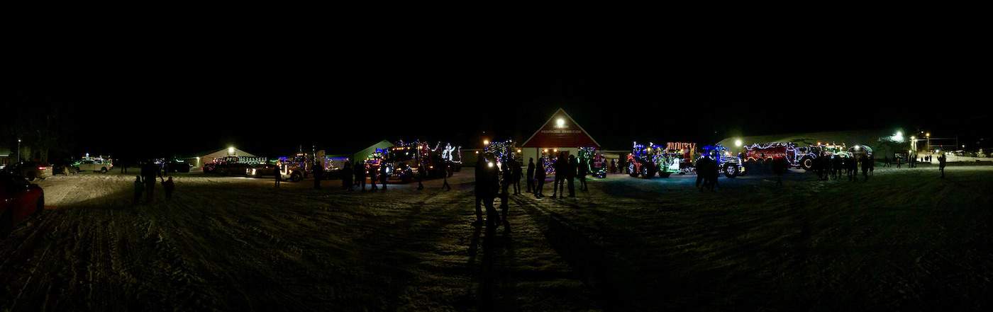 armstrong christmas tractor parade - tractors lit up at the IPE grounds